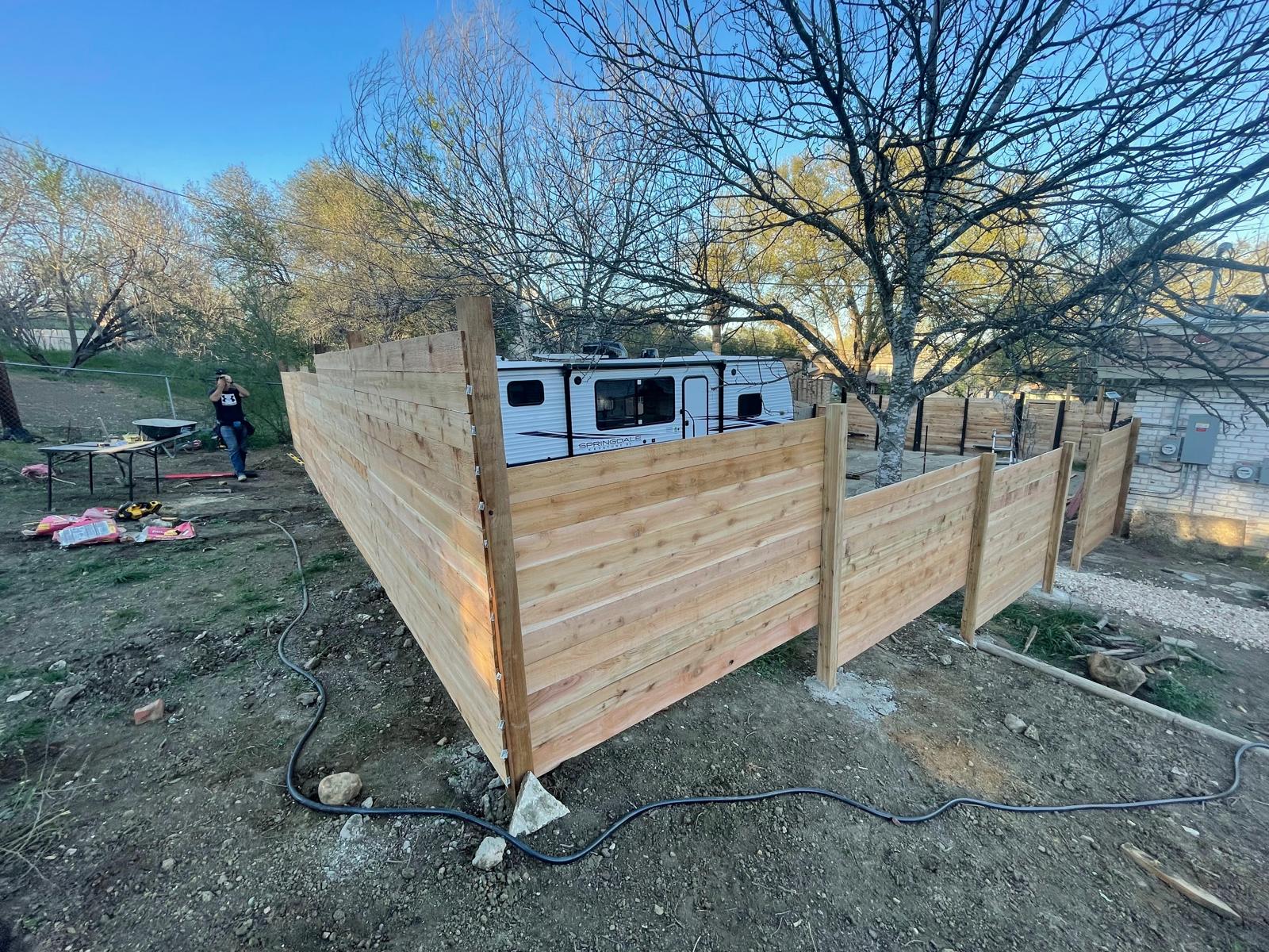 Cedar privacy fence installation by Risen Remodeling