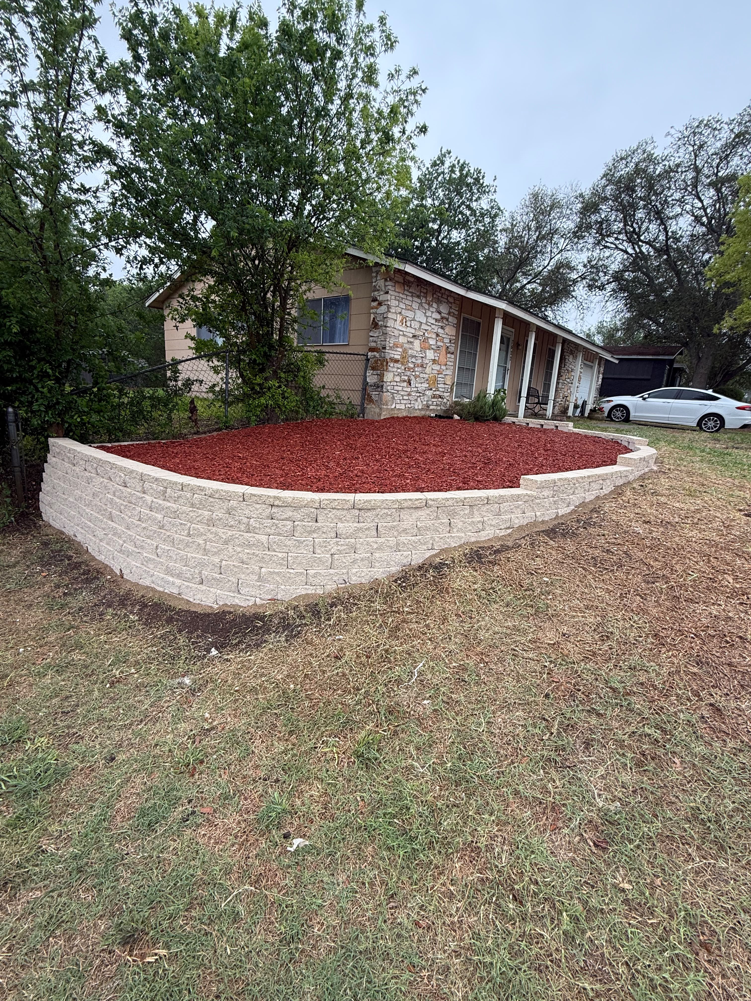 Retaining Wall & Landscape Bed, built by Risen Remodeling in New Braunfels, TX