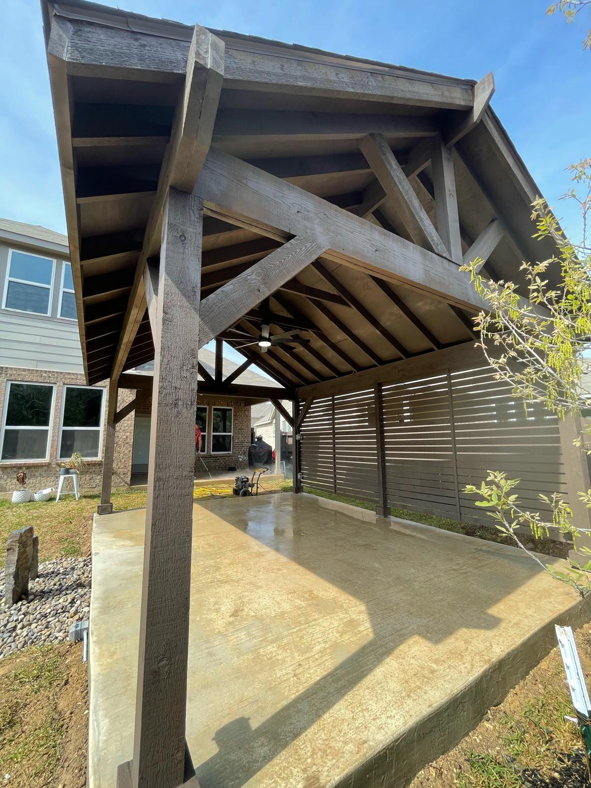 Custom wood gazebo with concrete patio built by Risen Remodeling