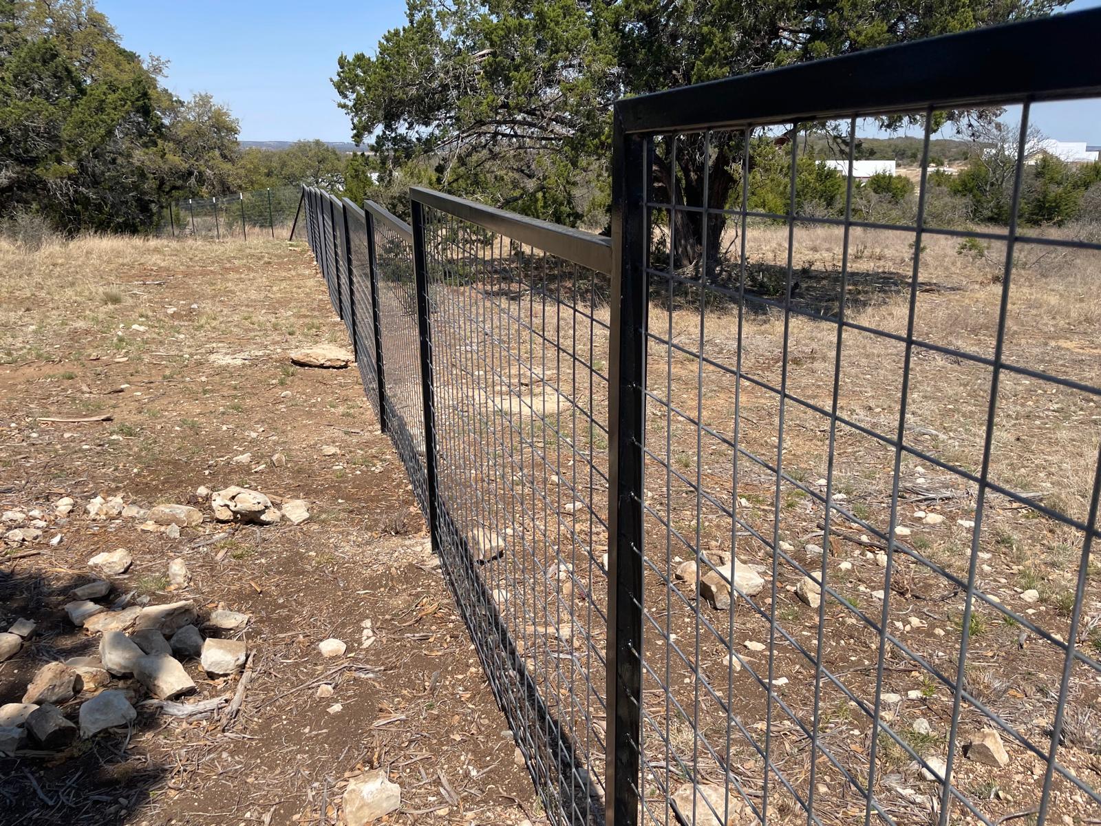 Metal fence with gate installed by Risen Remodeling